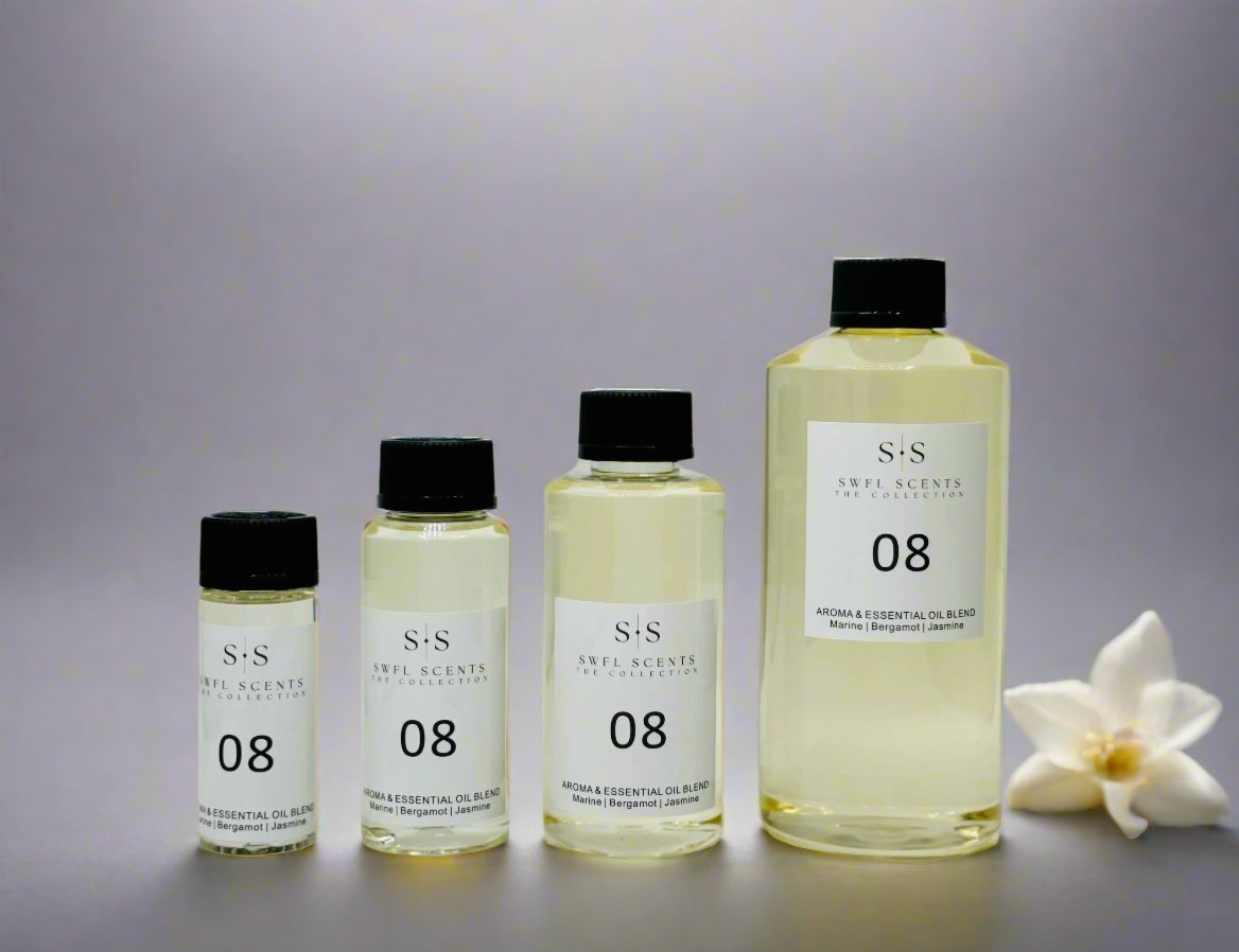 Four bottles of SWFL Scents essential oil blend in various sizes displayed in a row.